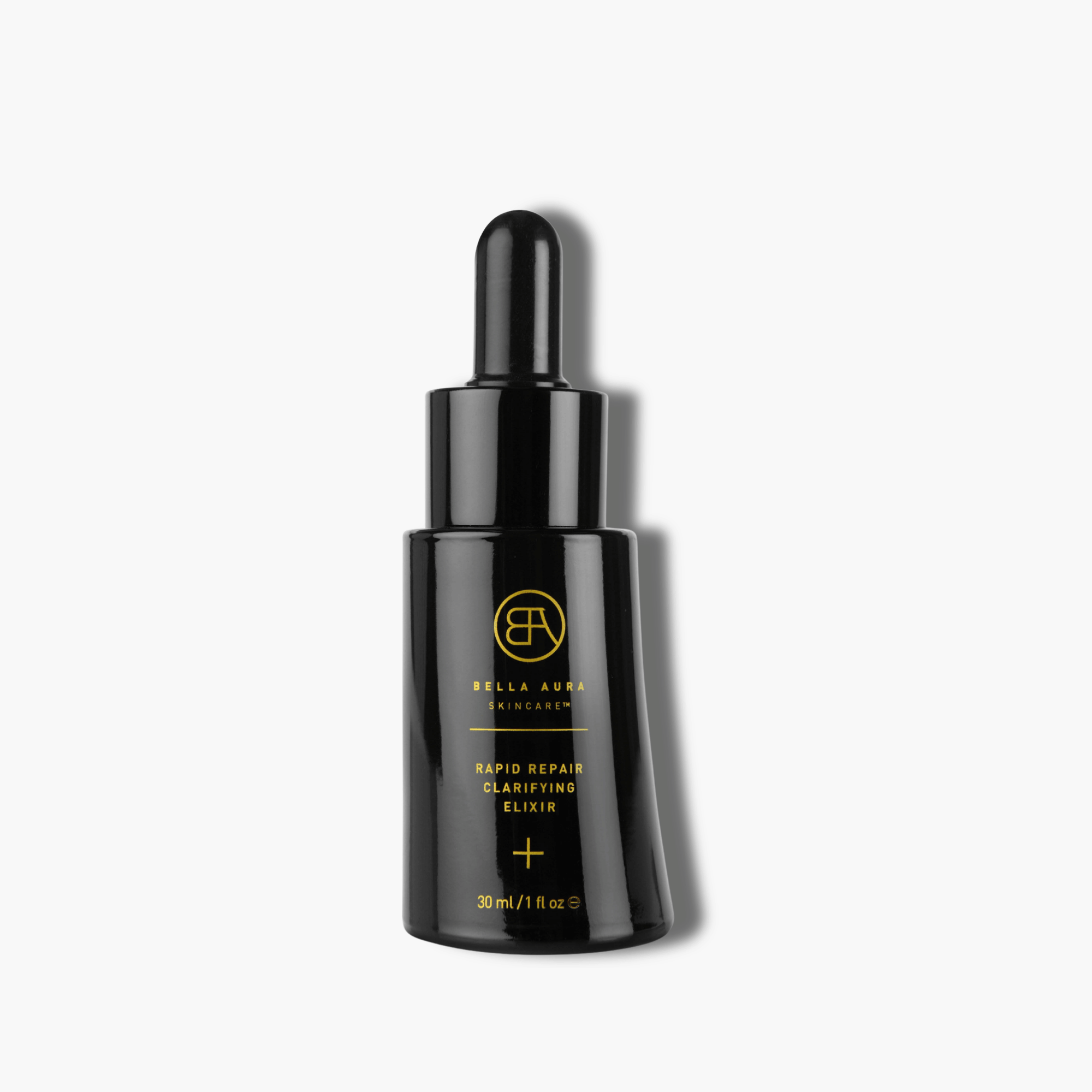 Black glass bottle skincare with gold text