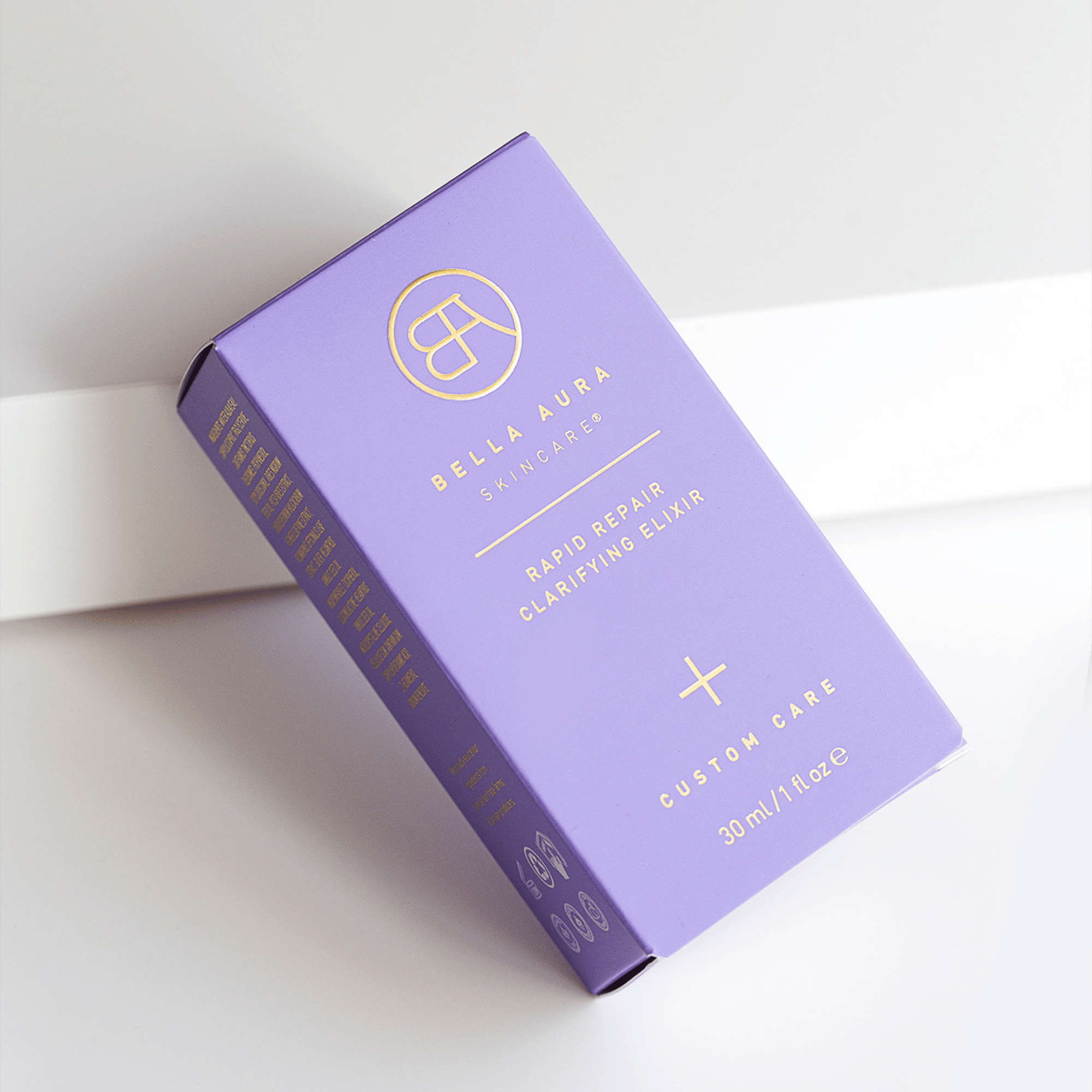 Purple packaging of Bella Aura product on a white background