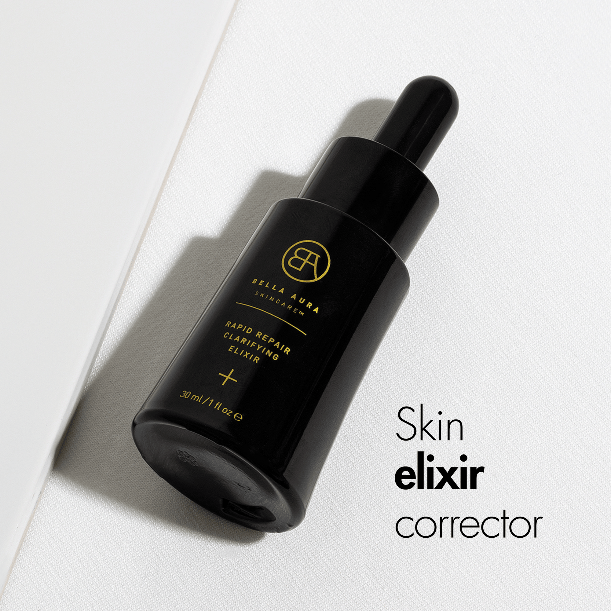 Black skincare dropper bottle with gold text on a white background