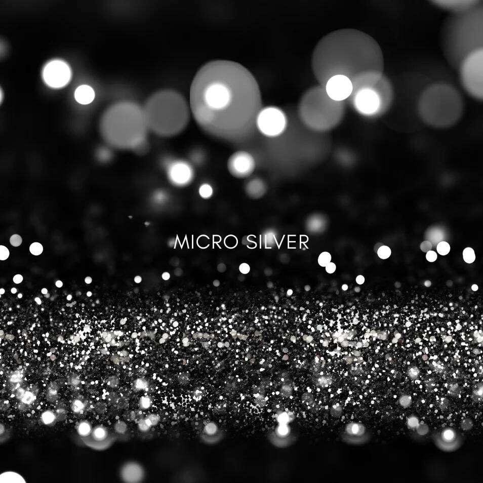 Glittering particles of micro silver with a bokeh effect, highlighting its antibacterial
properties in skincare.