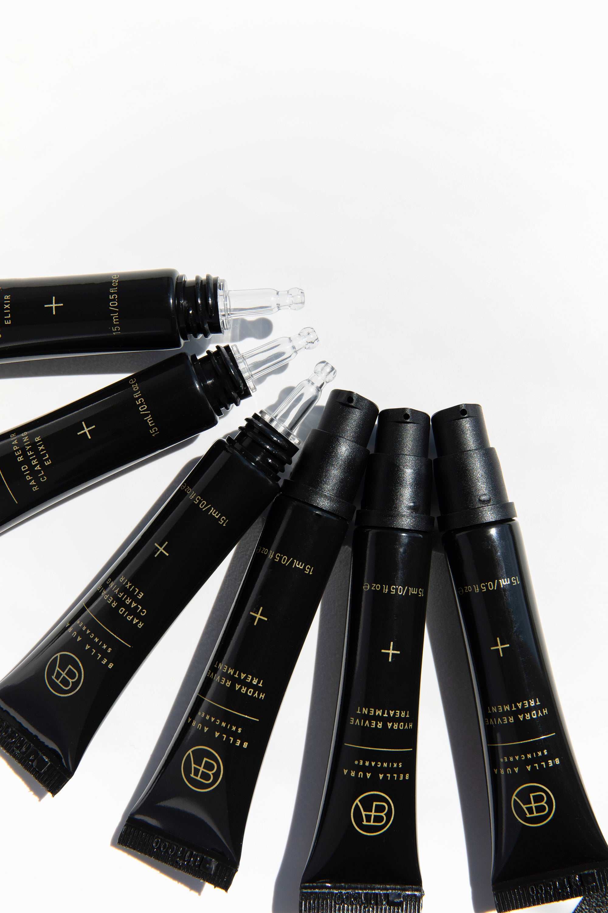 travel size mini bella aura tubes on a white background