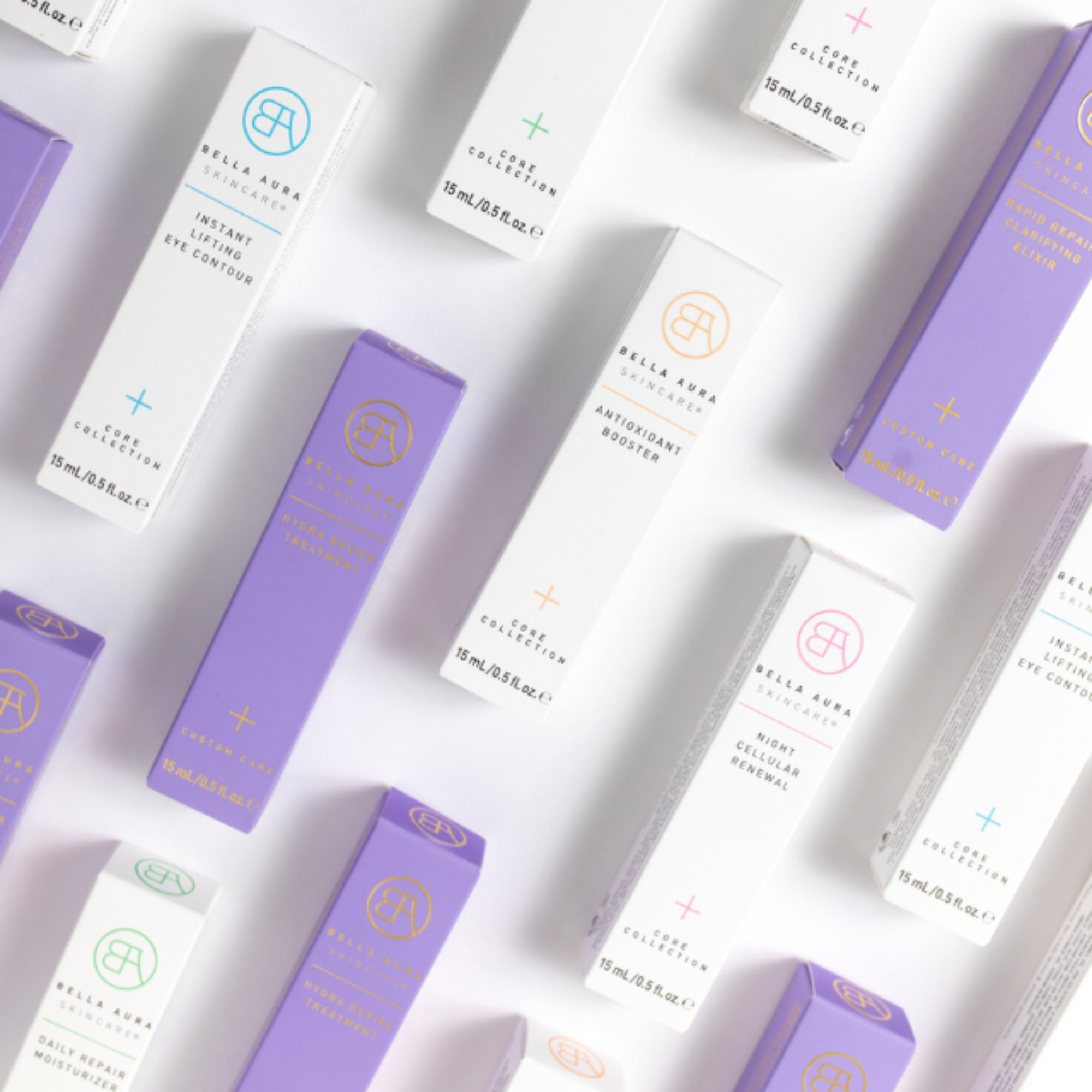 Various bella aura skincare products with purple and white packaging on a light gray background